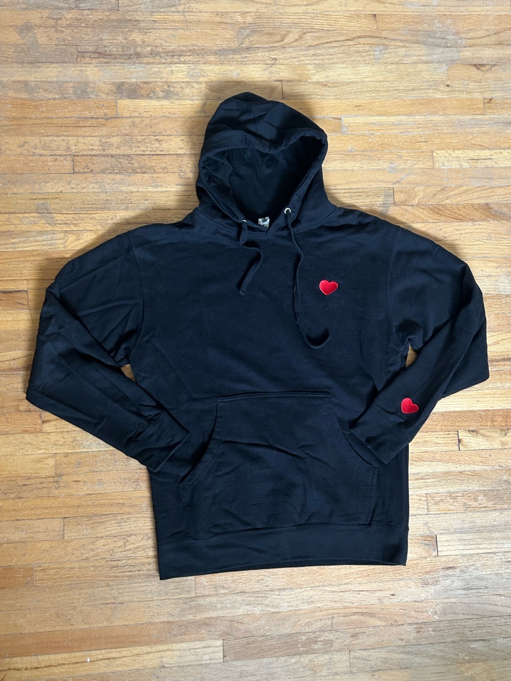 Black hoodie with embroidered heart detail